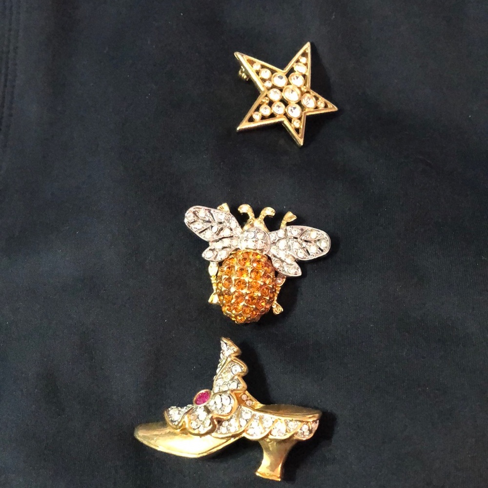 Crystal pins. Three gold pins.